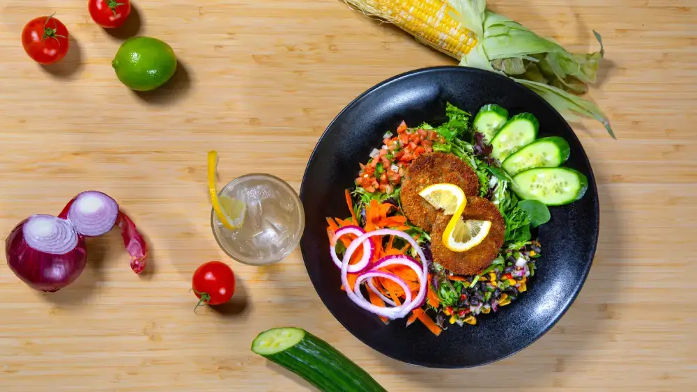 Delicious Crab Cake Salad at North Of The Bayou Jazz Club & Brewery in Madison, WI – Fresh greens, crispy crab cakes, and house-made remoulade.
