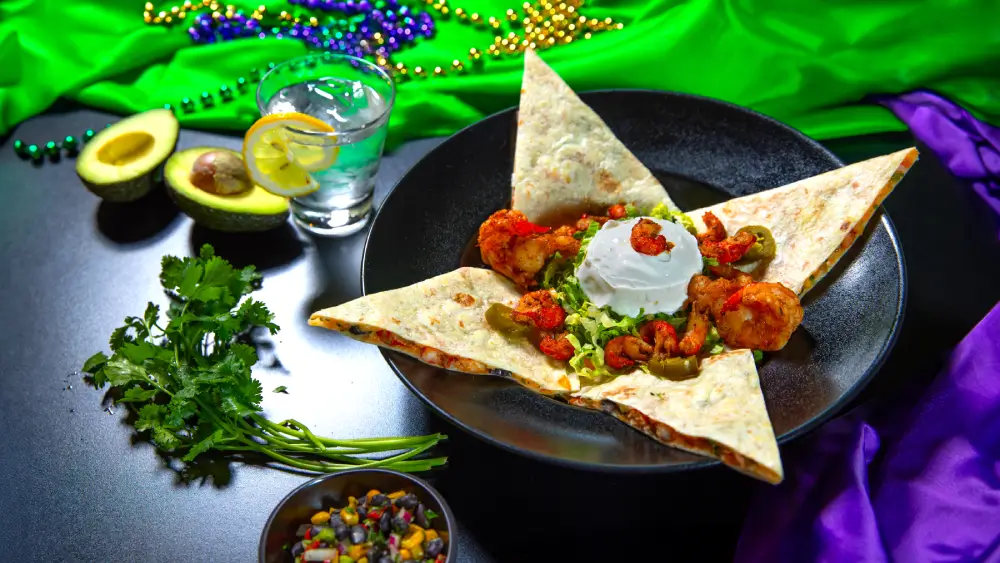 Delicious seafood quesadilla from North of the Bayou Brewery in Madison, WI, featuring fresh shrimp, melted cheese, and a crispy tortilla, served with house-made salsa and sour cream.