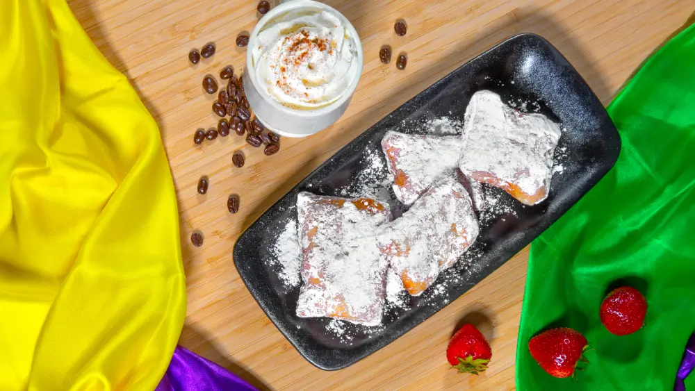 North of the Bayou Tiana's Beignets served fresh at North of the Bayou Brewery in Madison, WI – Crispy, delicious Southern-style pastries with powdered sugar, perfect for pairing with craft beer.